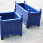 Versailles planters painted blue