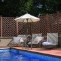 Custom trellis scheme around luxury pool