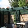 Town garden pergola painted green